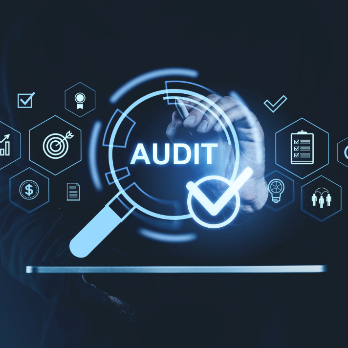 Digital graphic featuring the word 'AUDIT' in glowing white text inside a magnifying glass icon, with a hand drawing near the top center. The design is set against a dark background with various blue technology and finance icons, such as a target, dollar sign, and clipboard.