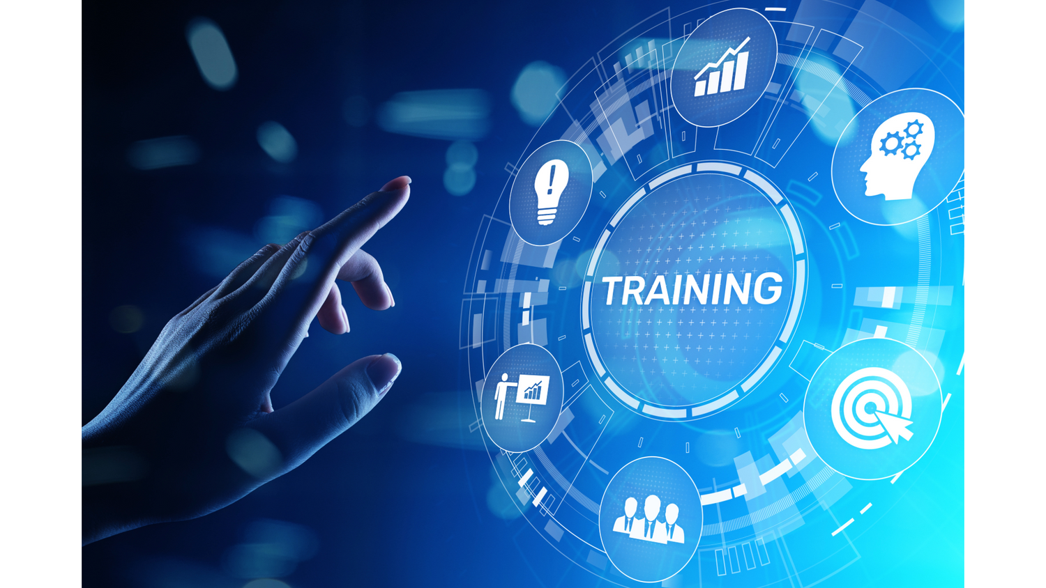 A futuristic blue digital graphic showing a human hand touching a holographic circular interface labeled TRAINING, with icons for growth, idea, brain, target, and group around the central word TRAINING.
